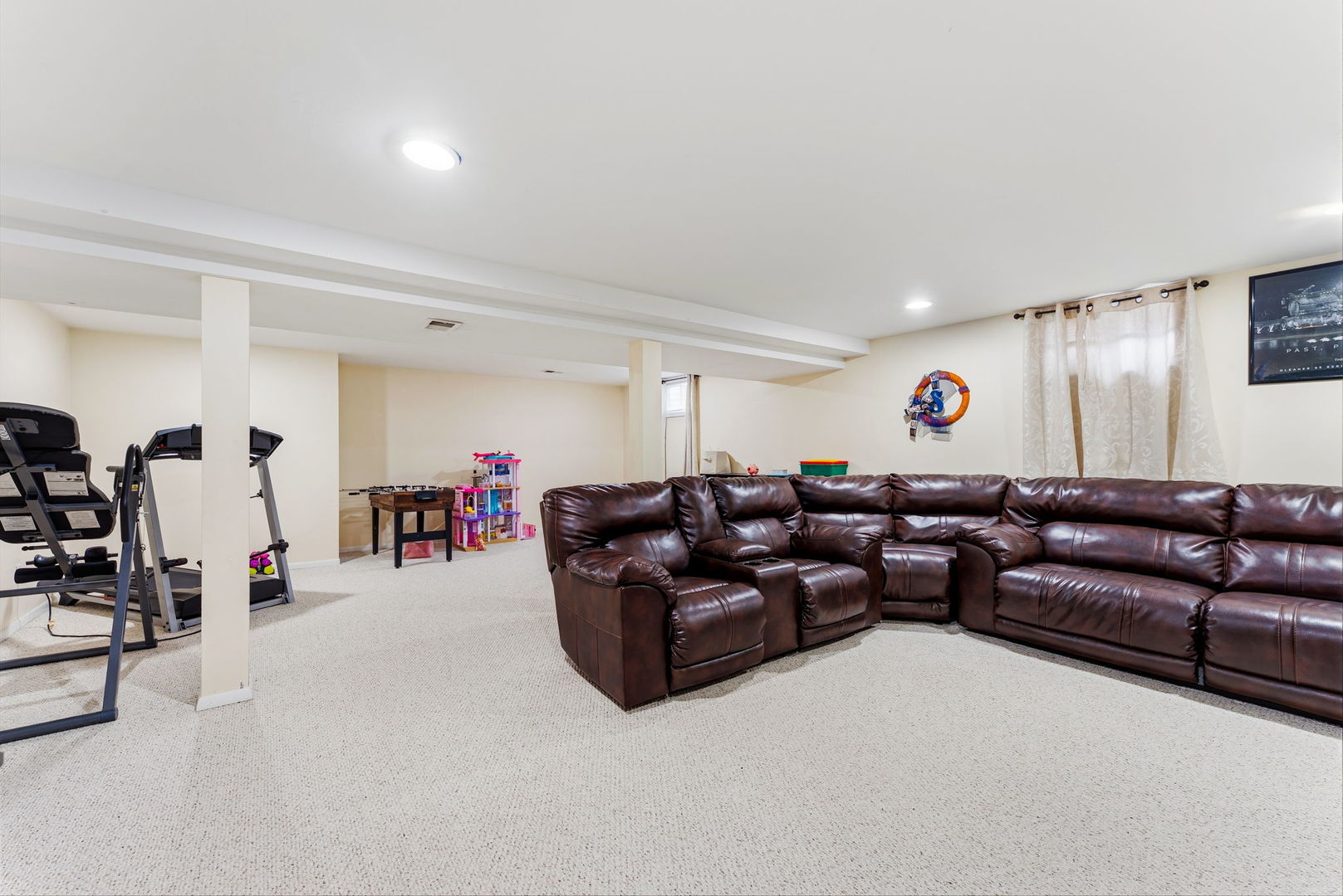 404 Southwest 10th Street Aledo, IL 61231 - Photo 21 of 27 a living room with furniture and gym equipment