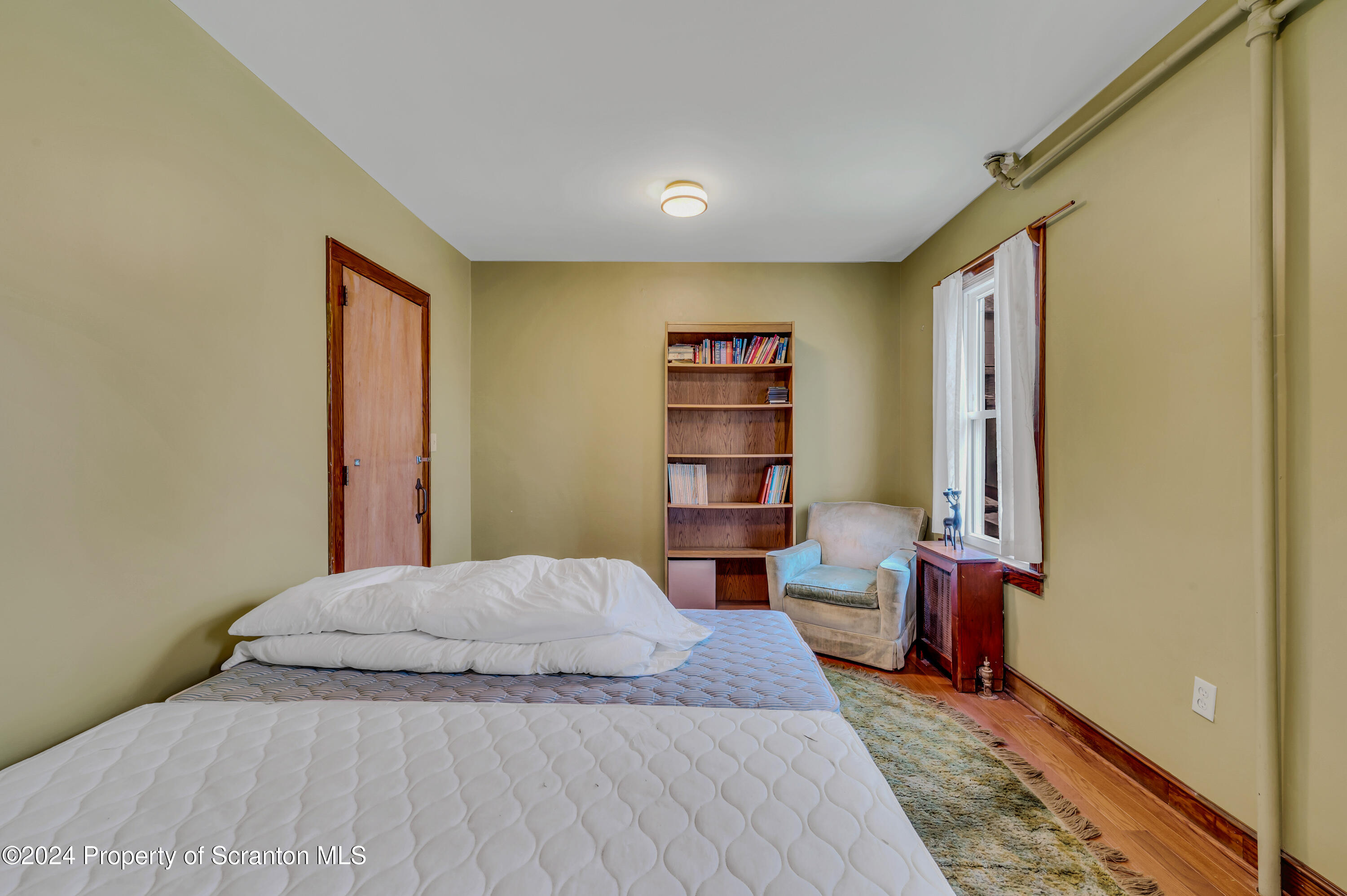 1128 County Home Road Montrose, PA 18801 - Photo 29 of 68 a bedroom with a bed and a window