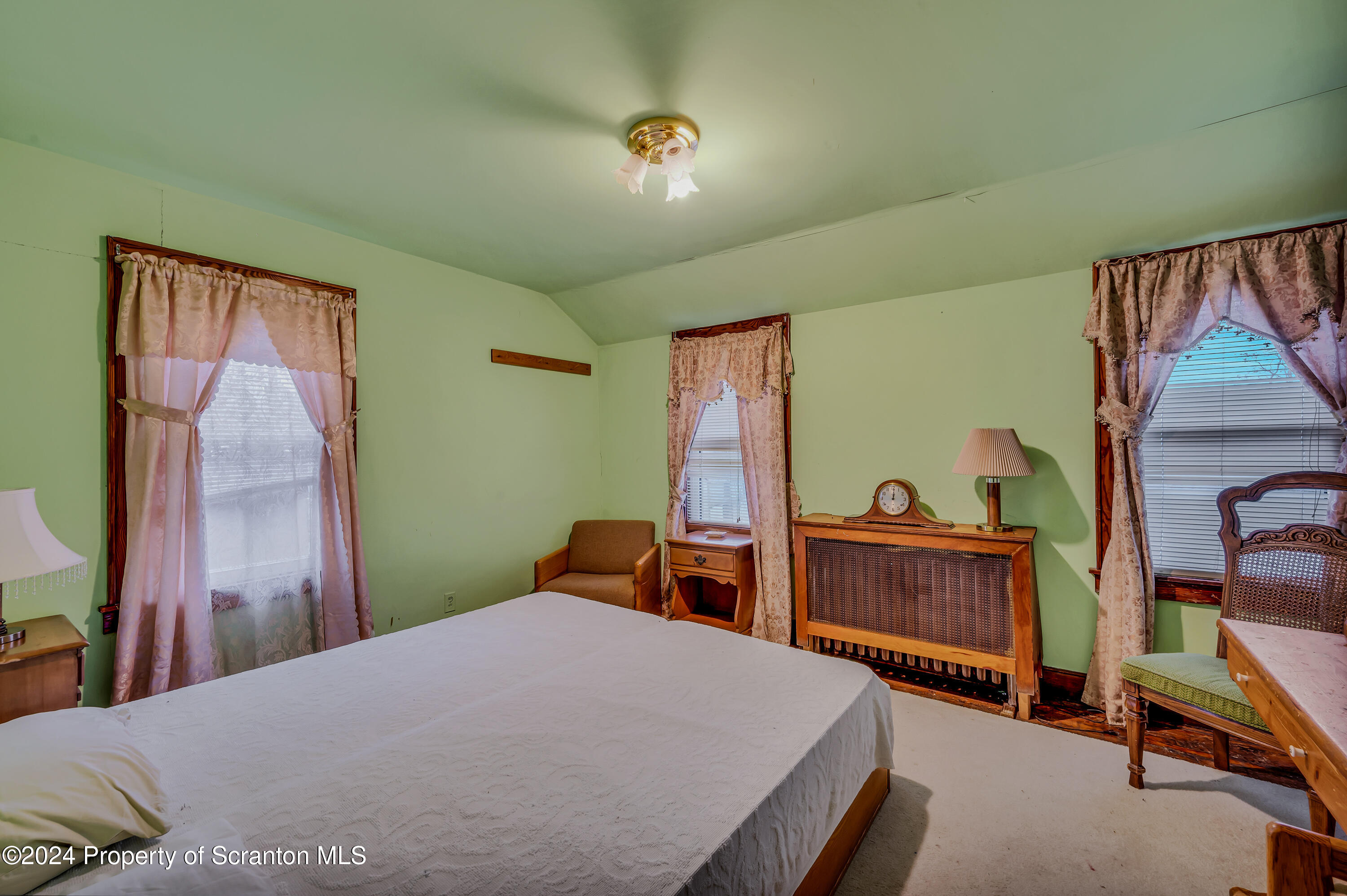 1128 County Home Road Montrose, PA 18801 - Photo 33 of 68 a bedroom with a bed and a dresser in it