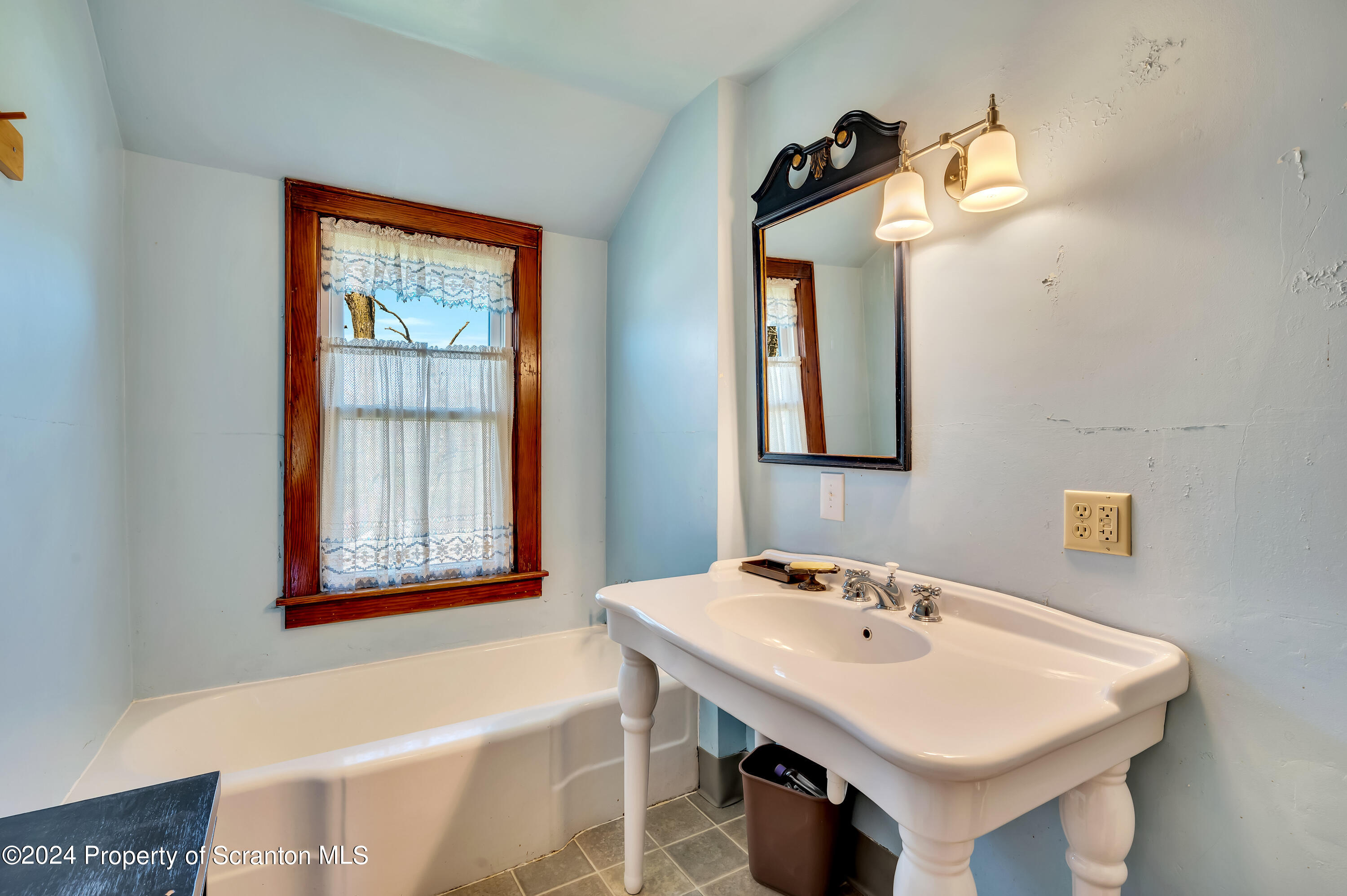 1128 County Home Road Montrose, PA 18801 - Photo 40 of 68 a bathroom with a sink and a mirror