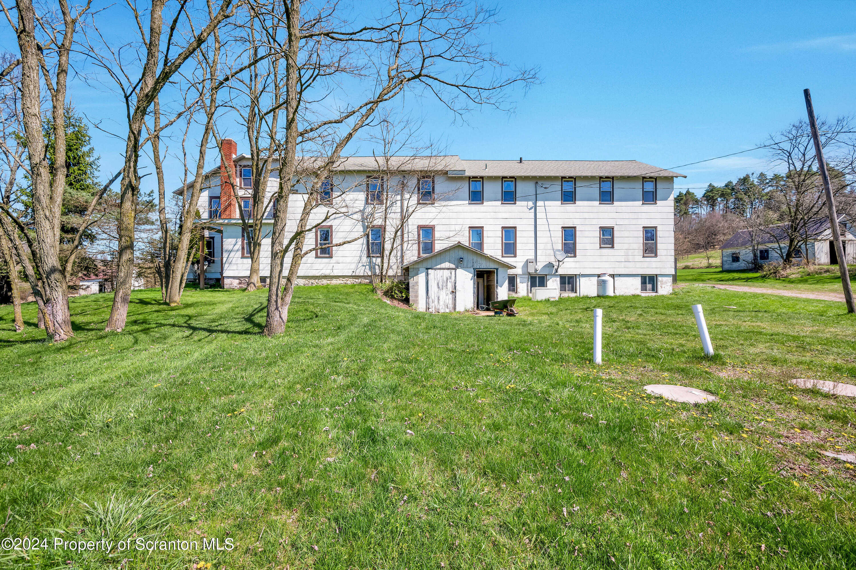 1128 County Home Road Montrose, PA 18801 - Photo 47 of 68 a view of a house with a yard