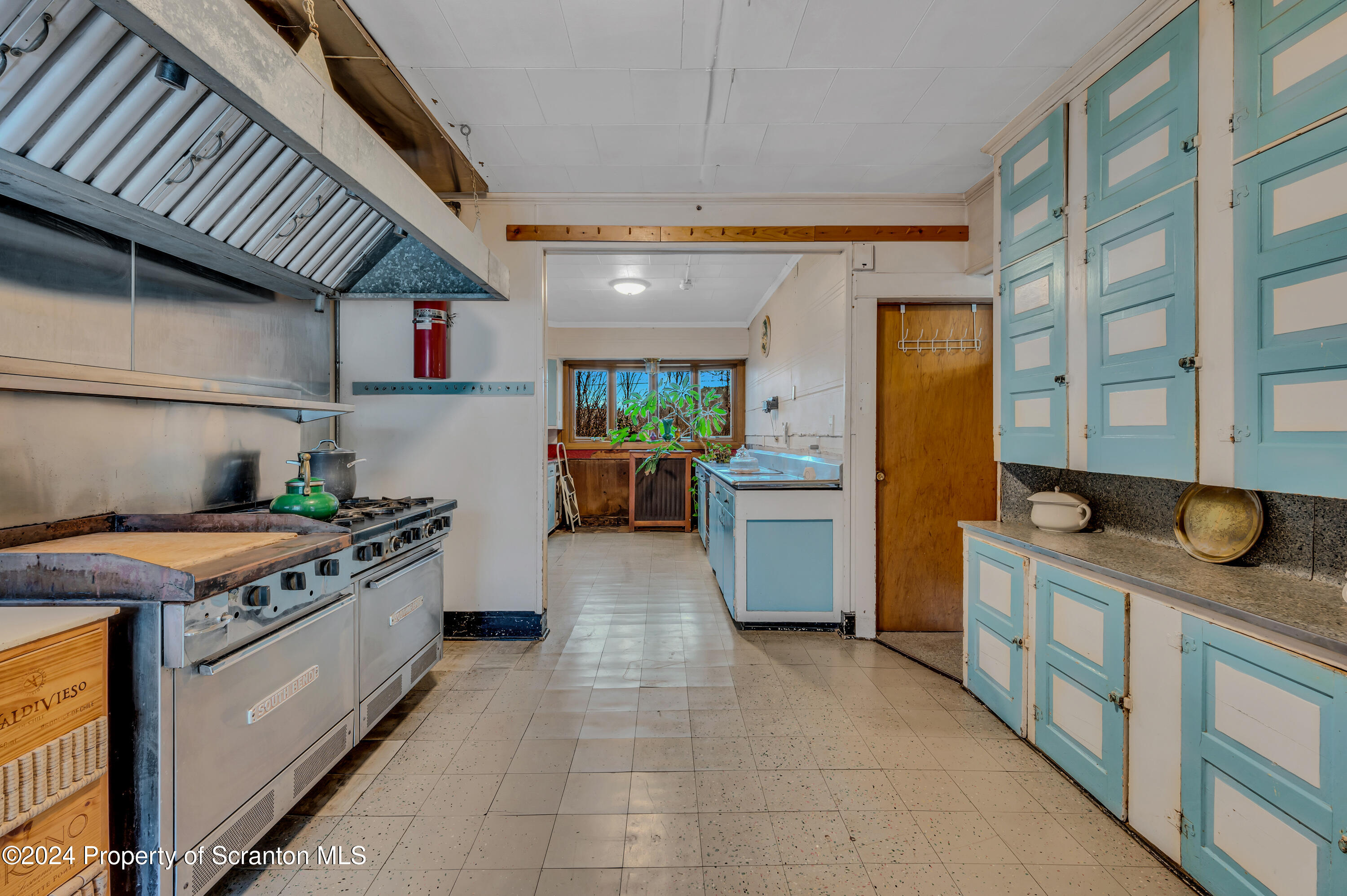 1128 County Home Road Montrose, PA 18801 - Photo 7 of 68 a kitchen with stainless steel appliances granite countertop a stove a sink dishwasher and a refrigerator