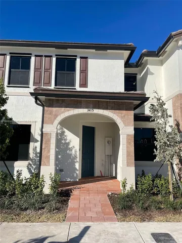 a front view of a house with yard