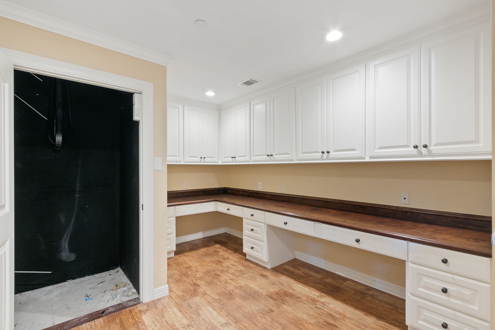 17018 Grant Road Cypress, TX 77429 - Photo 17 of 50 a kitchen with granite countertop white cabinets and refrigerator