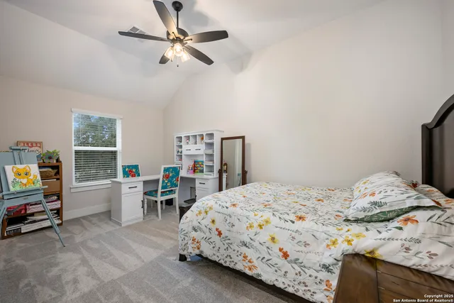 a bed room with a bed window and couch