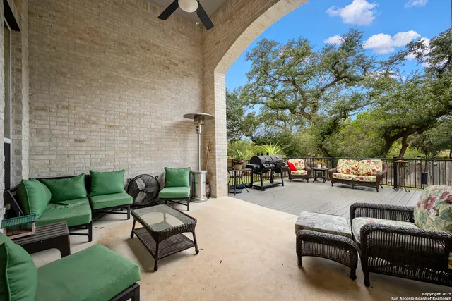 a patio with patio a couch and chairs
