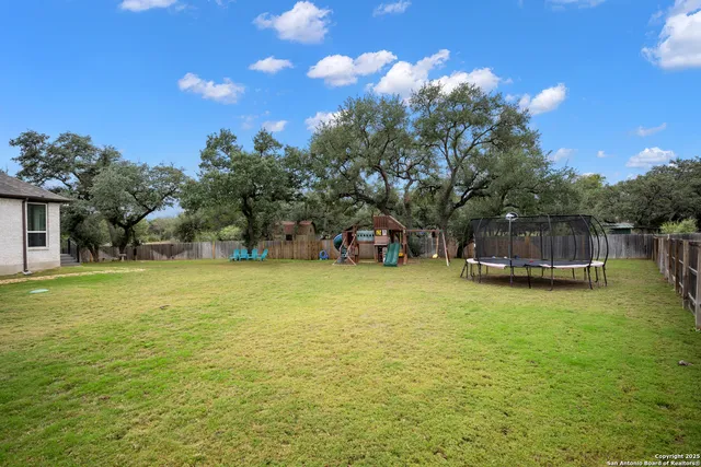 a house view with swimming pool and garden