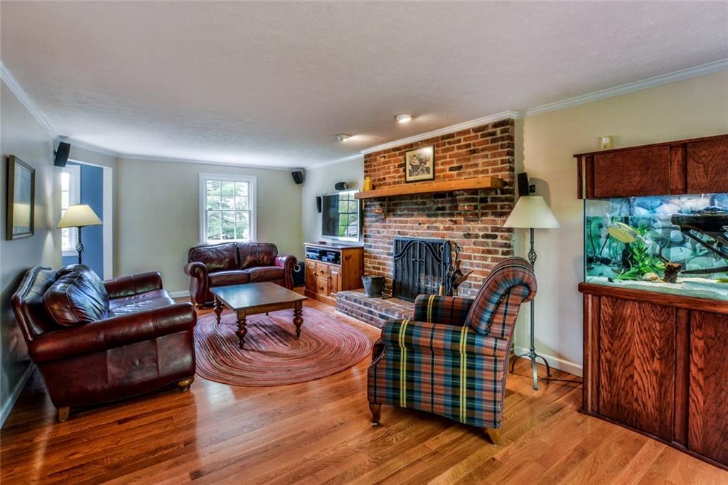 2075 Redcoach Road Allison Park, PA 15101 - Photo 11 of 25 Relax in the family room with a wood-burning brick fireplace as the focal point of this comforting room.
