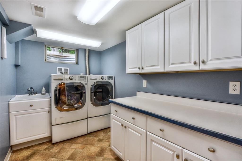 2075 Redcoach Road Allison Park, PA 15101 - Photo 19 of 25 Updated laundry room has cabinets and folding table.