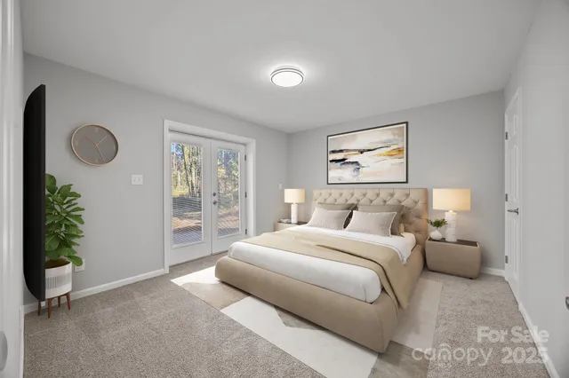 a spacious bedroom with a bed and a window