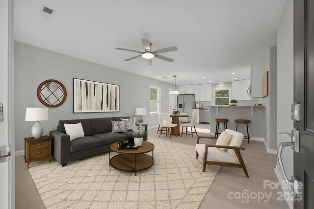 a living room with furniture and a table