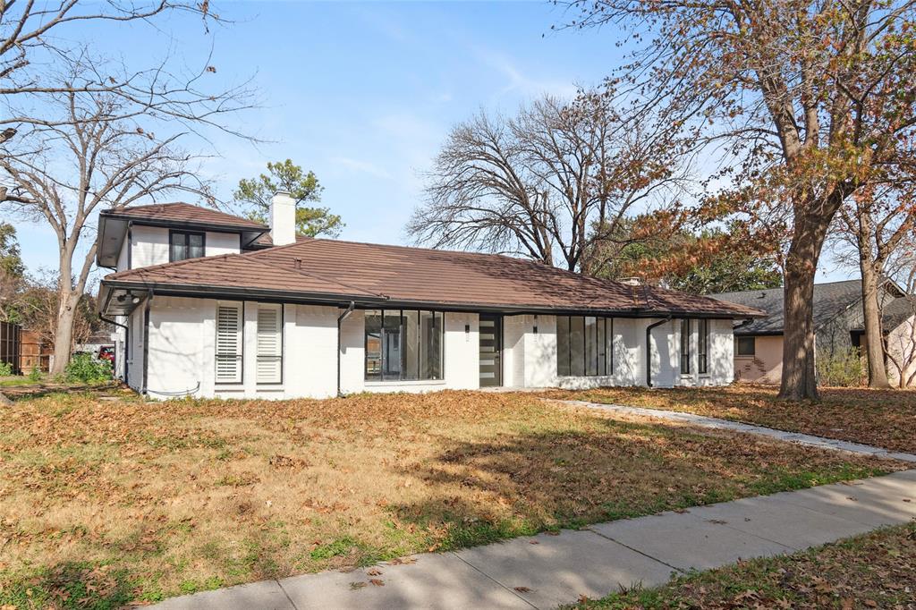 2325 Regal Road Plano, TX 75075 - Photo 2 of 34 front view of a house with a yard