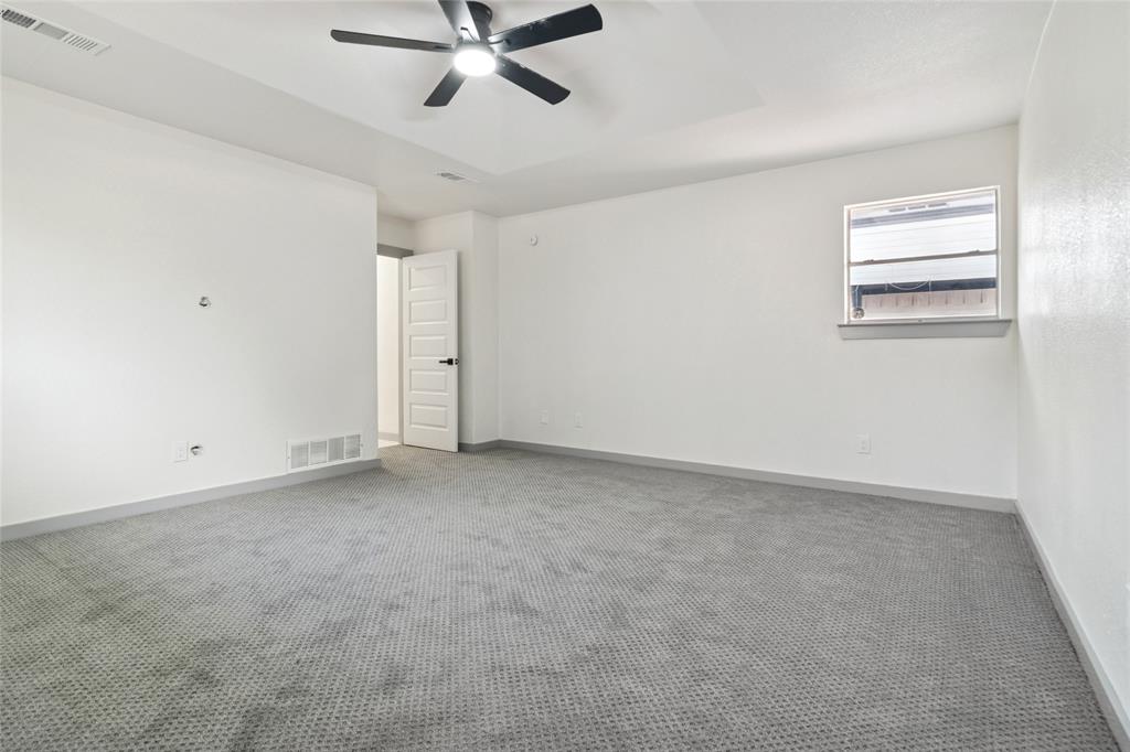 2325 Regal Road Plano, TX 75075 - Photo 29 of 34 a view of a room with a ceiling fan and window
