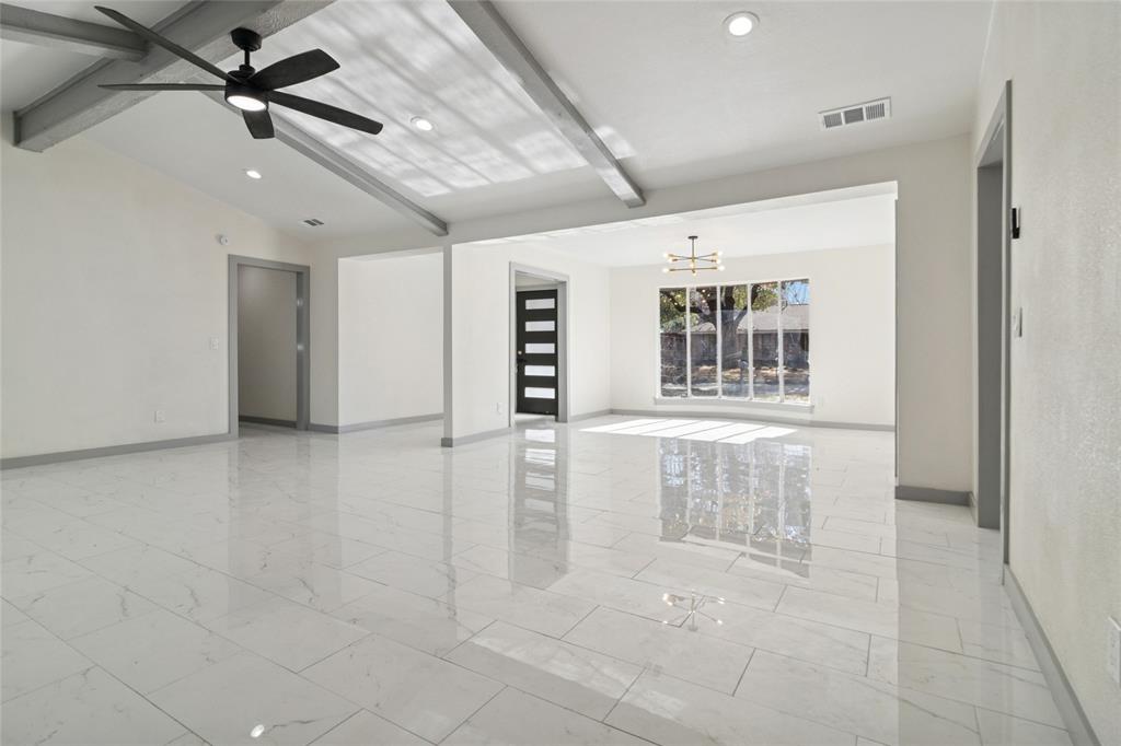2325 Regal Road Plano, TX 75075 - Photo 3 of 34 a view of an empty room with a window