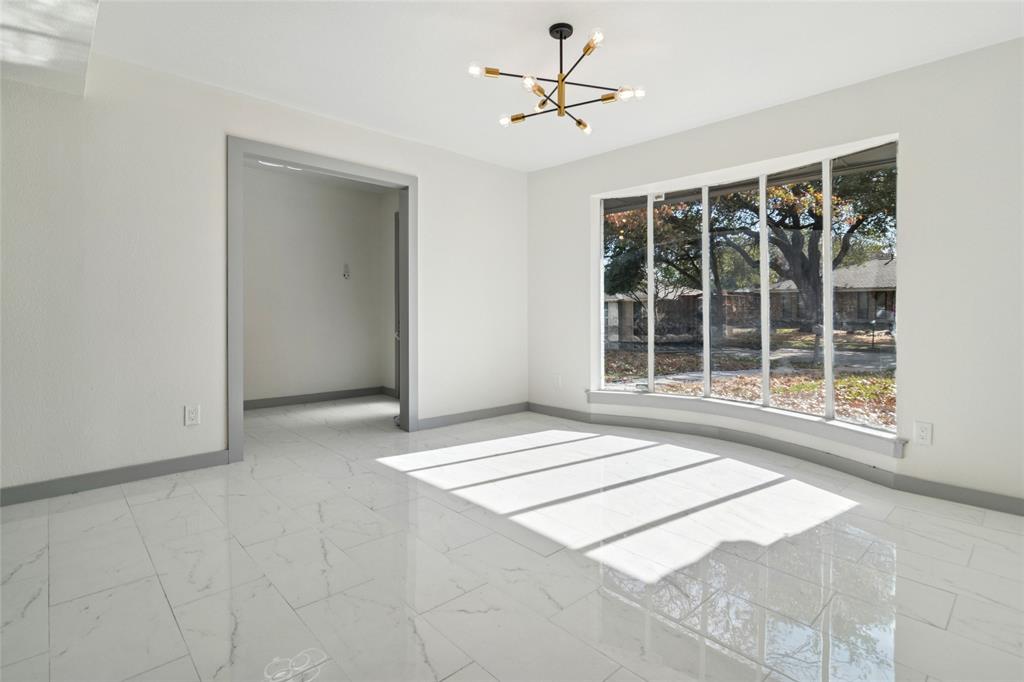 2325 Regal Road Plano, TX 75075 - Photo 5 of 34 a view of an empty room with a window