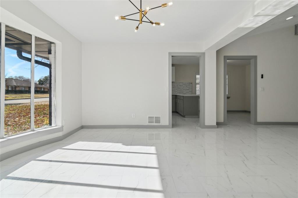 2325 Regal Road Plano, TX 75075 - Photo 6 of 34 an empty room with windows and closet