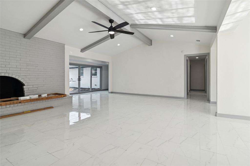 2325 Regal Road Plano, TX 75075 - Photo 8 of 34 an empty room with windows and ceiling fan