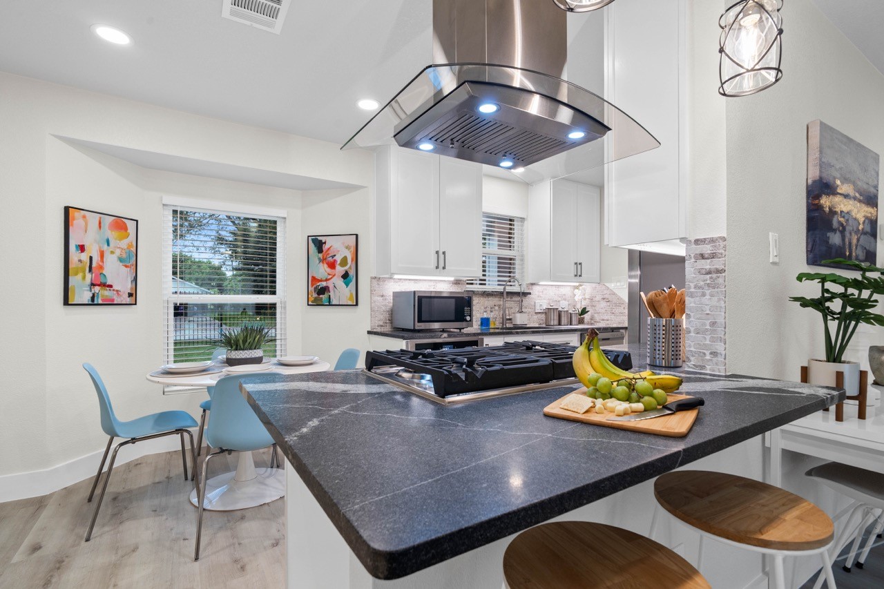 3138 Sunbeam Street Houston, TX 77051 - Photo 18 of 50 Clean lines, bright soft-close cabinetry, and an airy breakfast space create a fresh, modern kitchen designed for everyday living and effortless hosting.