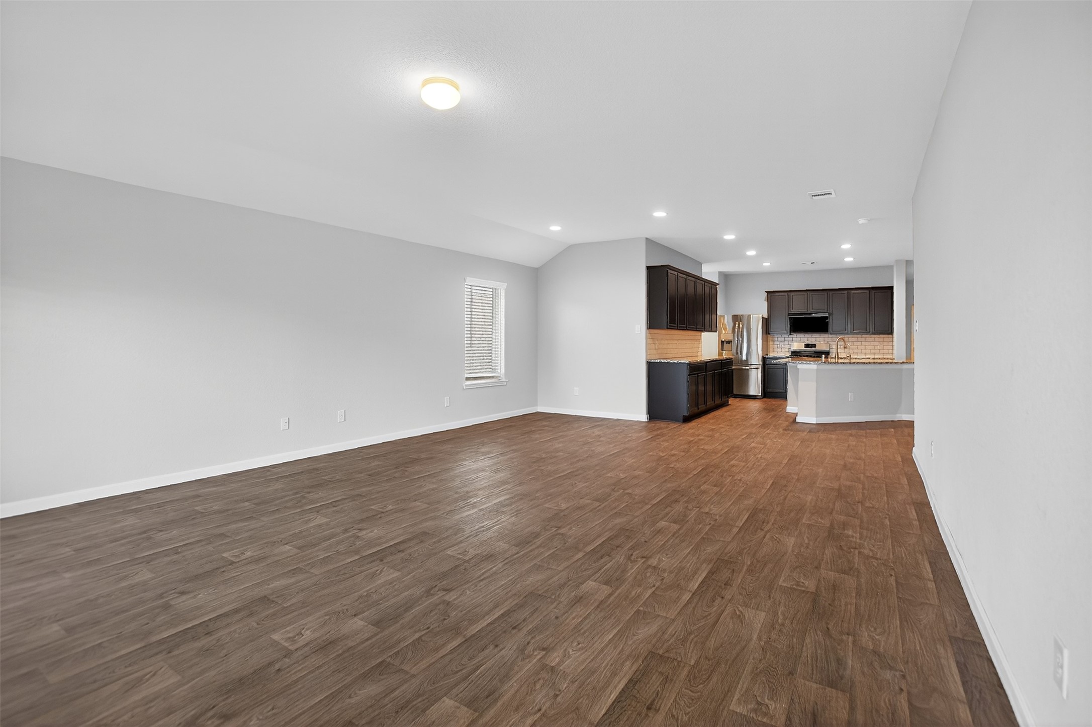 3310 Sumac Drive Katy, TX 77494 - Photo 15 of 45 a view of a kitchen with a sink and a refrigerator