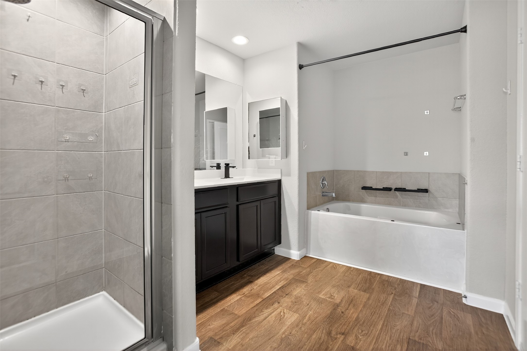 3310 Sumac Drive Katy, TX 77494 - Photo 22 of 45 a bathroom with a bathtub a sink and a shower