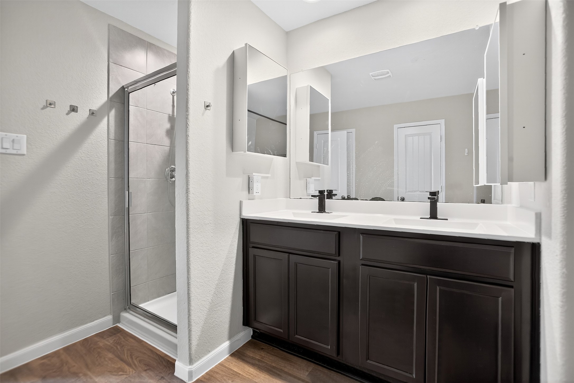 3310 Sumac Drive Katy, TX 77494 - Photo 23 of 45 a bathroom with 2 sink and a mirror