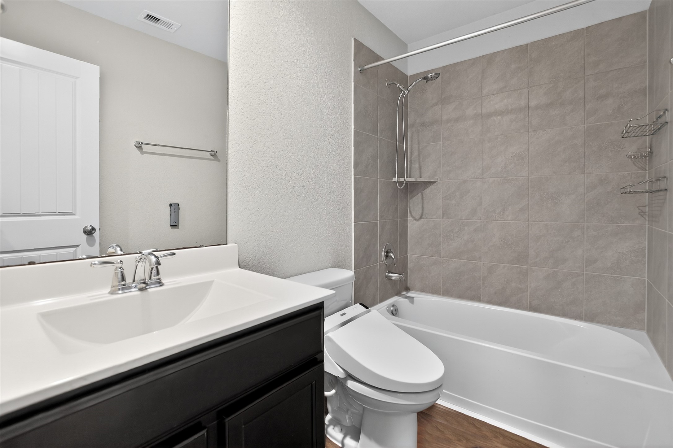 3310 Sumac Drive Katy, TX 77494 - Photo 28 of 45 a bathroom with a sink a toilet and a bathtub