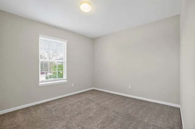 a large kitchen with stainless steel appliances kitchen island granite countertop a stove a sink dishwasher a microwave oven and a refrigerator with wooden floor