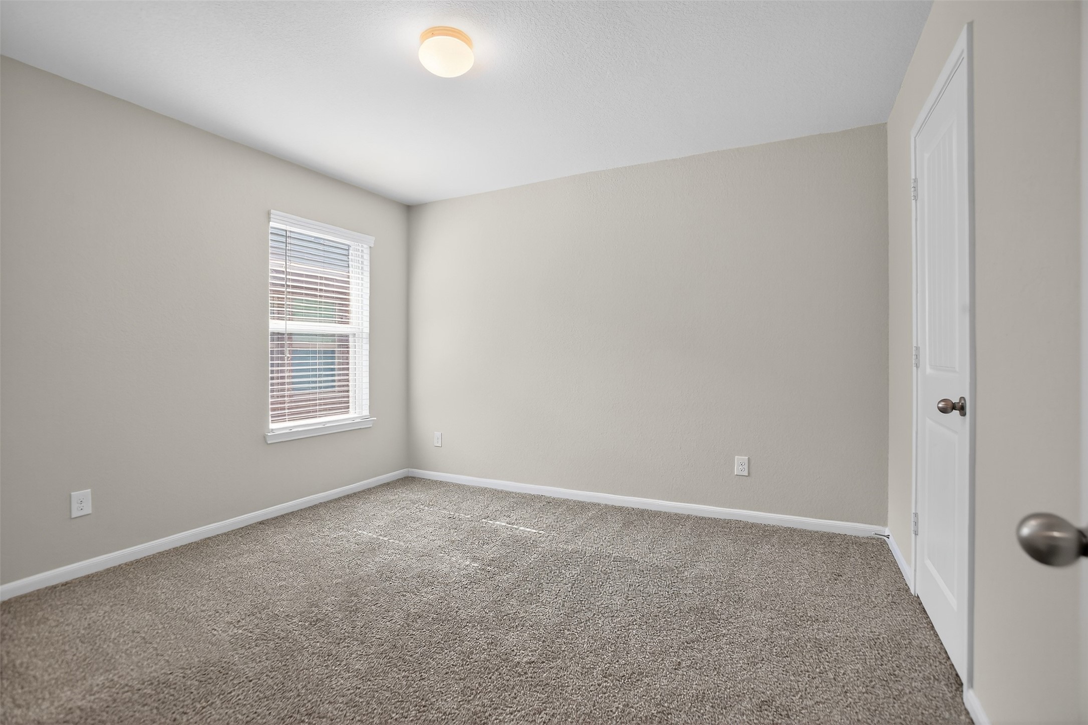 3310 Sumac Drive Katy, TX 77494 - Photo 30 of 45 an empty room with windows and closet