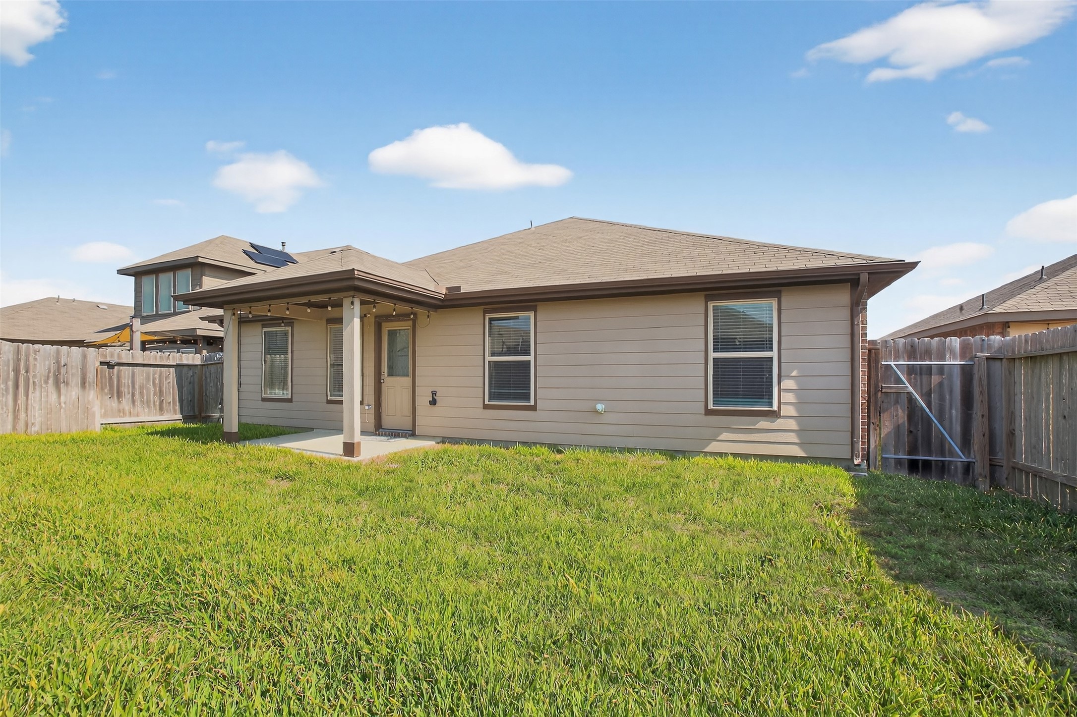 3310 Sumac Drive Katy, TX 77494 - Photo 37 of 45 a backyard of a house with table and chairs