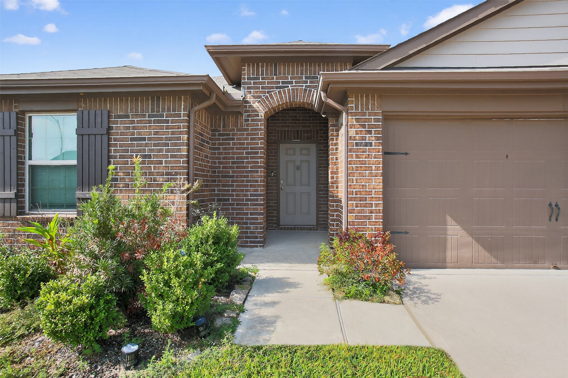 3310 Sumac Drive Katy, TX 77494 - Photo 4 of 45 a front view of a house with garden