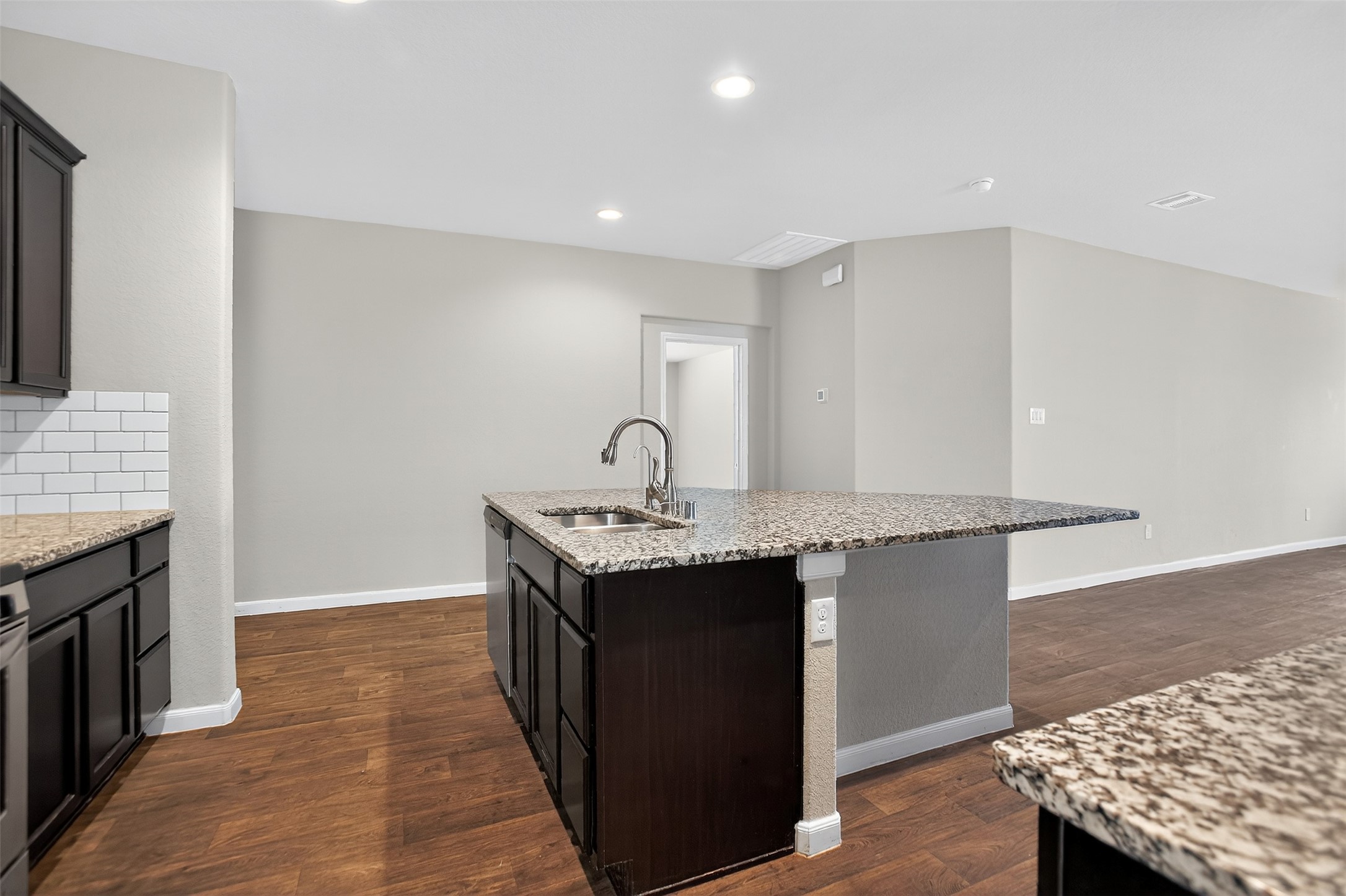 3310 Sumac Drive Katy, TX 77494 - Photo 10 of 45 a kitchen with granite countertop a sink and a stove