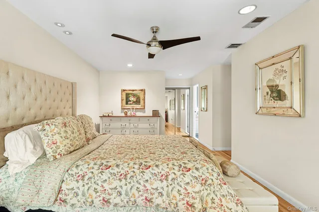 a spacious bedroom with a large bed and a couch