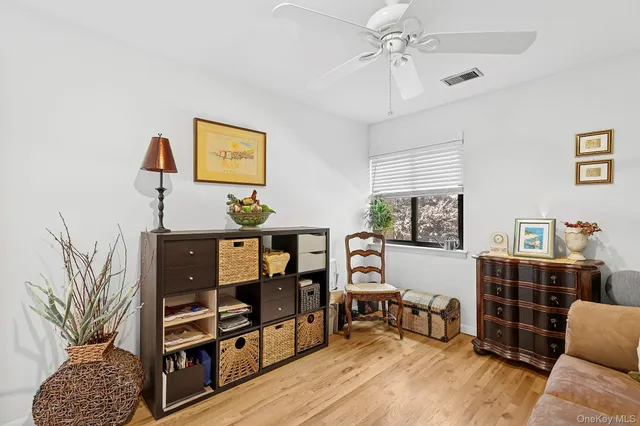 a bedroom with furniture a rug and a window