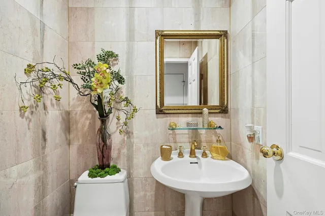 a bathroom with a sink a mirror and a toilet