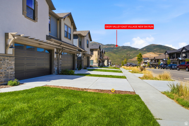 6039 North Westridge Road Heber City, UT 84032 - Photo 50 of 71 Modern townhome exterior with stone accents, horizontal siding, and a two-car garage