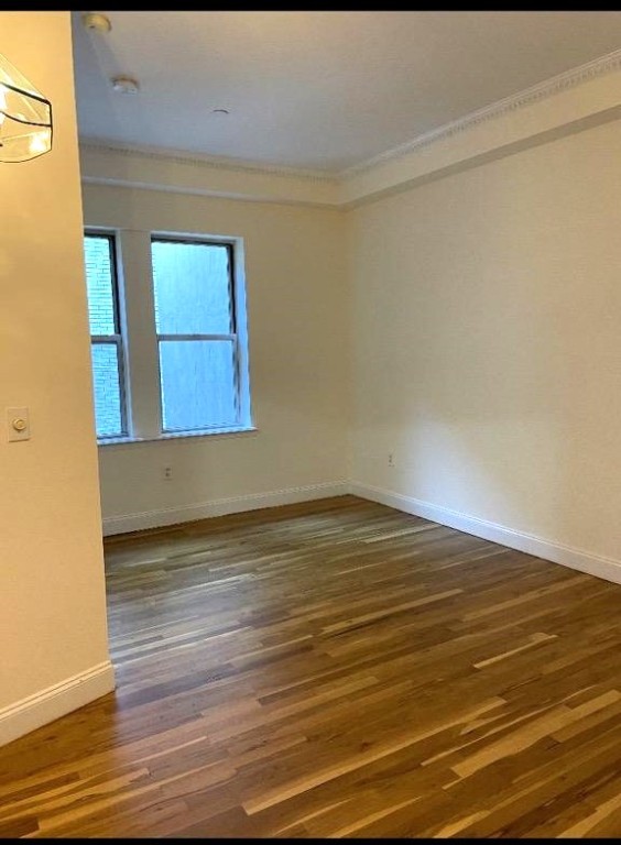 57 Sip Avenue, Unit 8D Jersey City, NJ 07306 - Photo 2 of 4 a view of an empty room and wooden floor