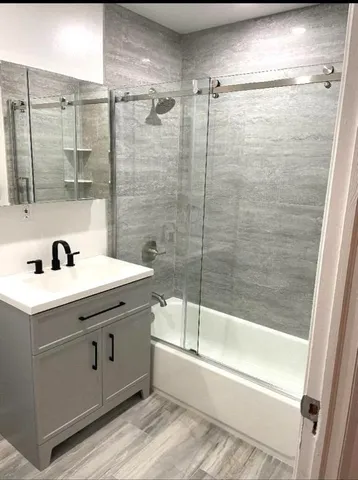 a bathroom with a bathtub and a sink