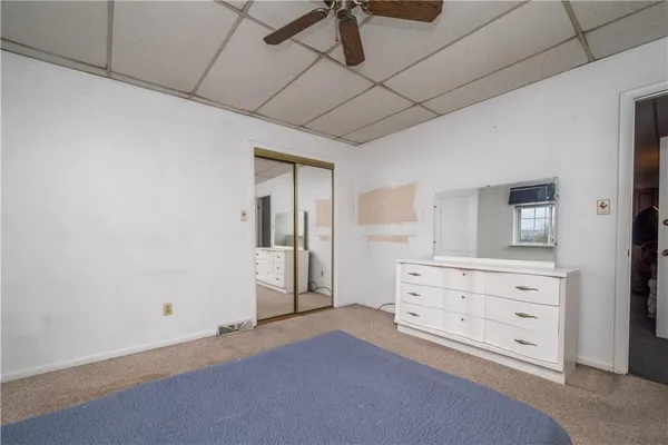 a room with furniture and mirror