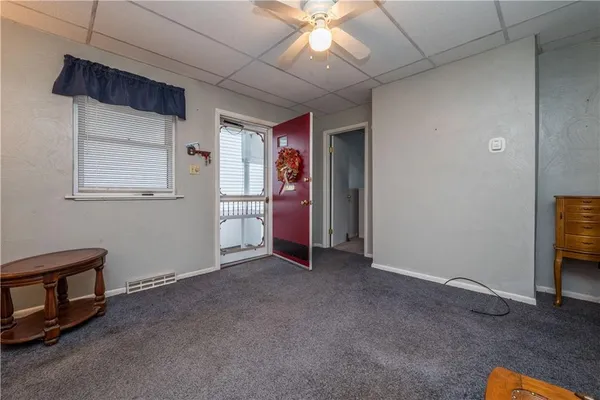 a view of empty room with workspace and windows