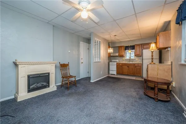a view of a livingroom with furniture and a fireplace