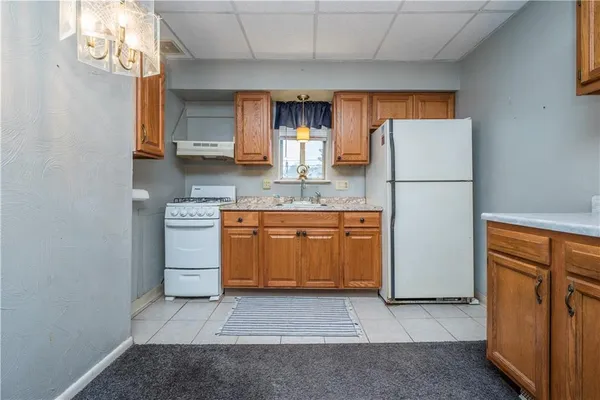 a kitchen with stainless steel appliances a refrigerator and cabinets