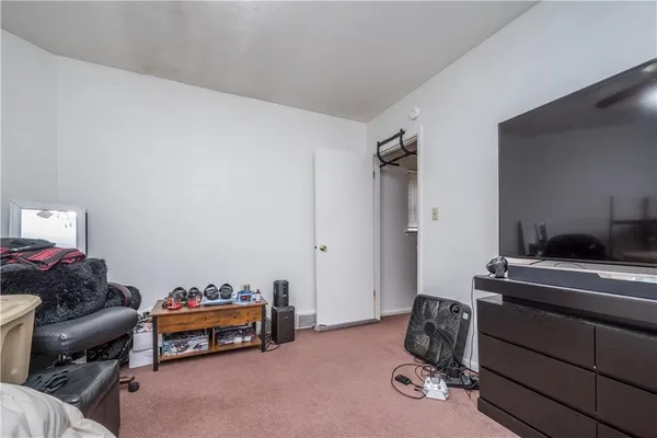 a bedroom with furniture and a piano