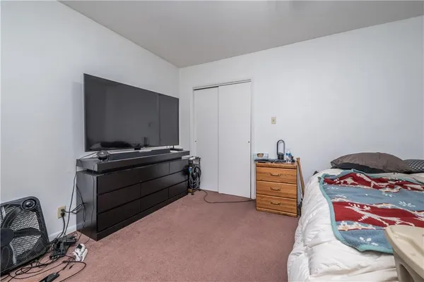 a room with furniture and flat screen tv
