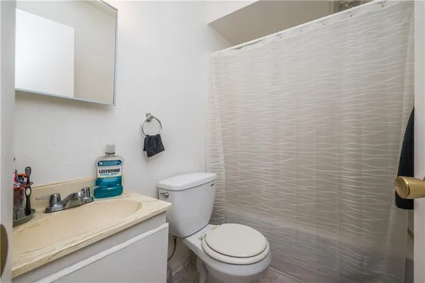 a bathroom with a toilet and sink