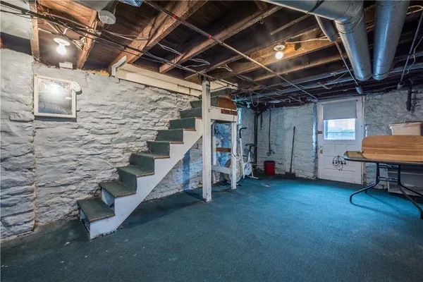 a view of an empty room with stairs