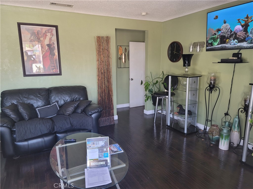 1408 South Burris Avenue Compton, CA 90221 - Photo 12 of 29 a living room with furniture and wooden floor