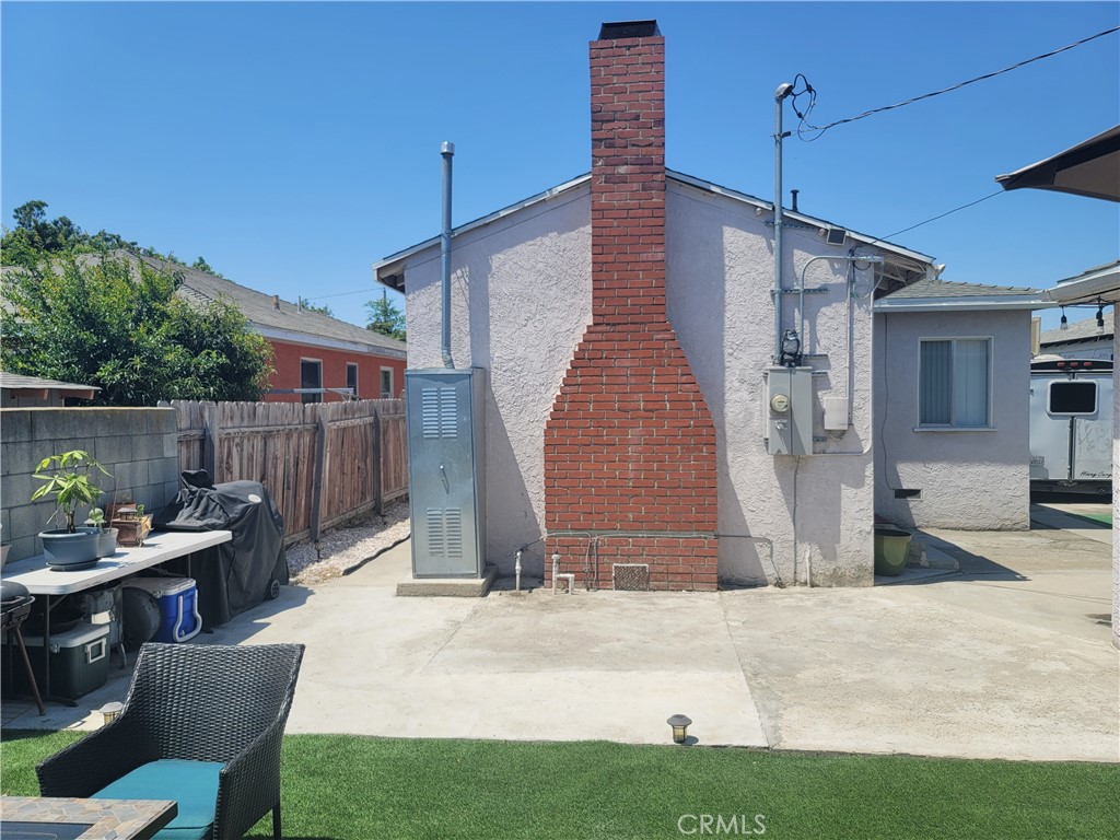 1408 South Burris Avenue Compton, CA 90221 - Photo 15 of 29 a outdoor space with patio furniture and wooden floor