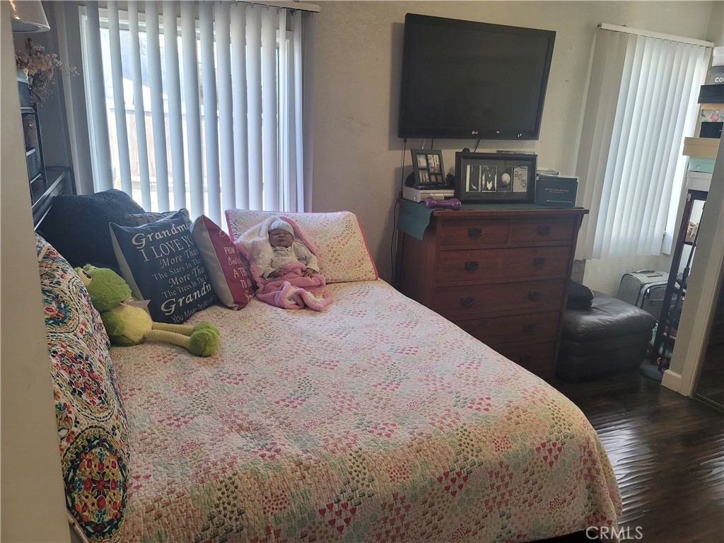 1408 South Burris Avenue Compton, CA 90221 - Photo 20 of 29 a bedroom with a bed and flat screen tv