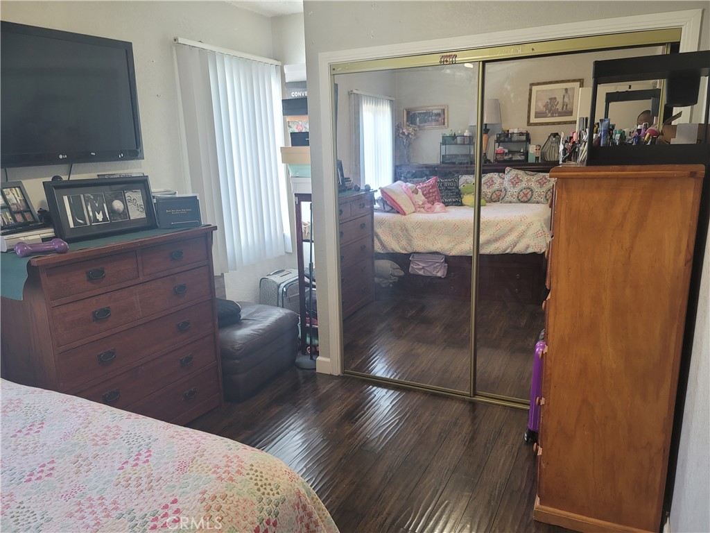 1408 South Burris Avenue Compton, CA 90221 - Photo 22 of 29 a bedroom with a bed and large glass window