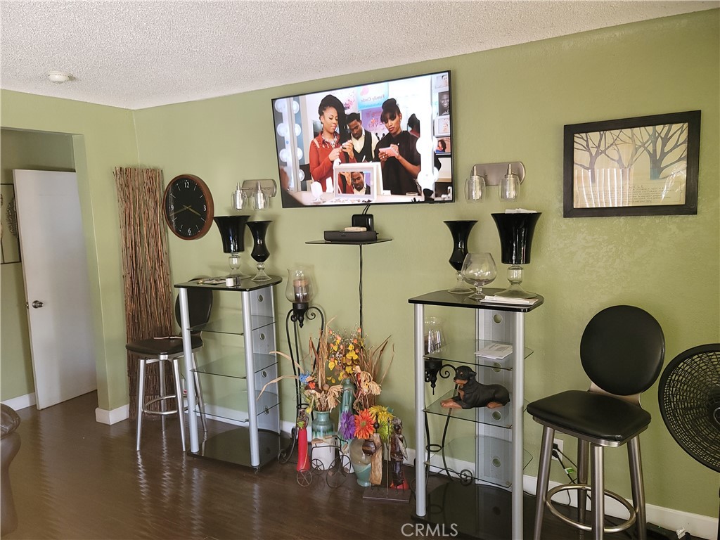 1408 South Burris Avenue Compton, CA 90221 - Photo 3 of 29 a room with furniture and wooden floor